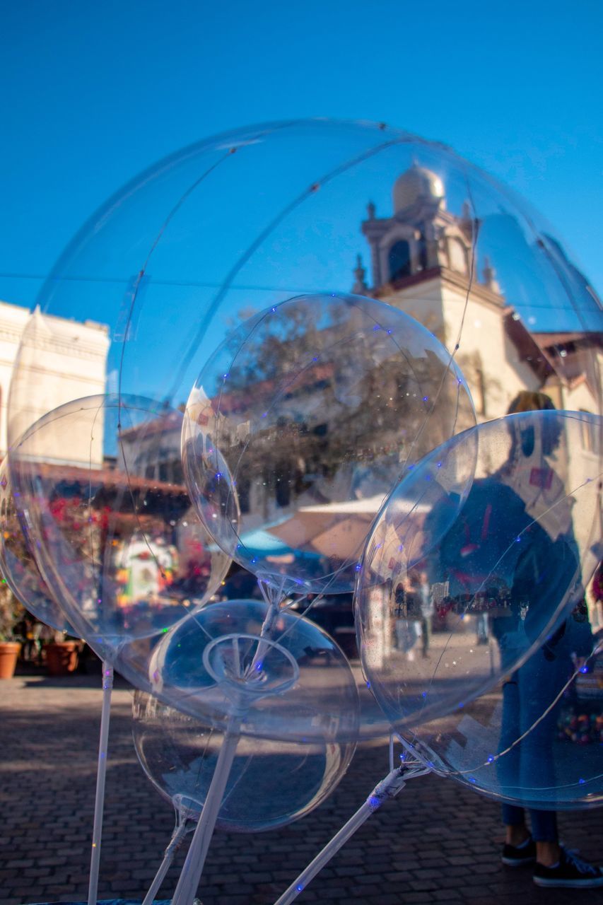 CLOSE-UP OF BUBBLES IN GLASS BUILDING