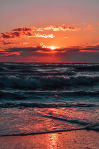 Scenic view of sea against romantic sky at sunset