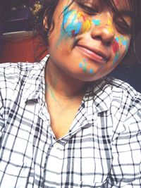 Close-up portrait of woman with face paint