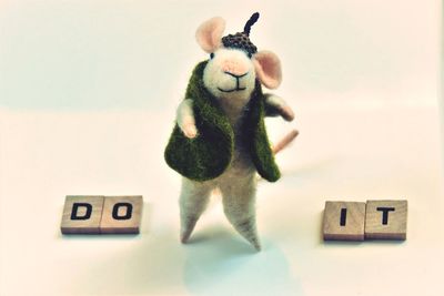 Close-up of toy on table against white background