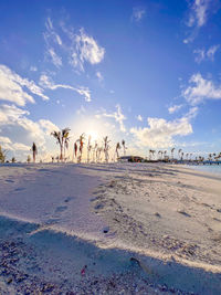 Scenic view of beach against sky during sunset