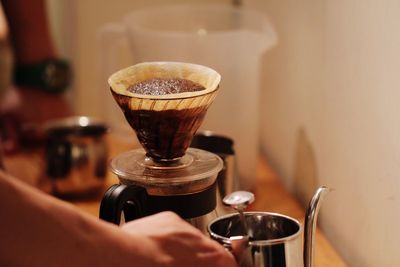 Close-up of hand holding coffee