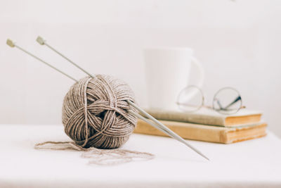 Close-up of sewing equipment on table