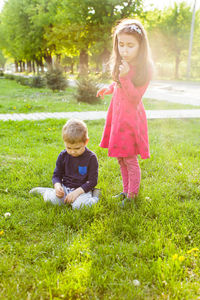 Full length of mother and daughter in park