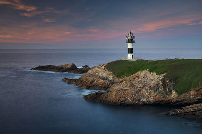 Lighthouse at sunset in galicia