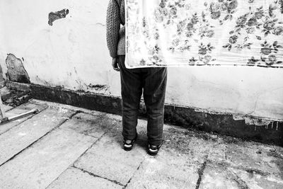 Low section of man walking on street