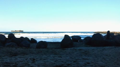 Scenic view of sea against clear blue sky