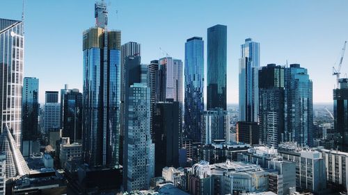 Skyscrapers in city against clear sky