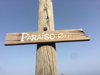 Low angle view of tree against clear blue sky