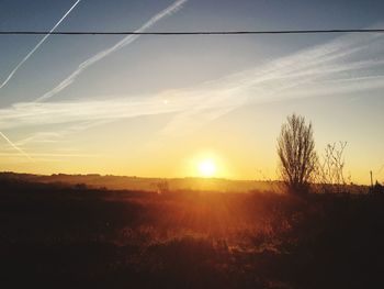 Scenic view of landscape at sunset