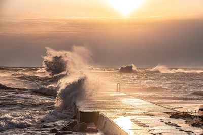 Scenic view of sea against sky during sunset