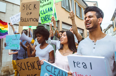 People with banners protesting in city