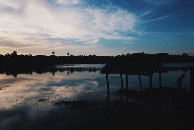 Scenic view of beach against sky during sunset