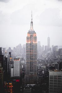 Buildings in city against sky