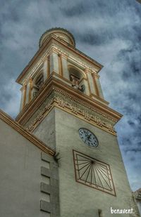 Low angle view of building against cloudy sky