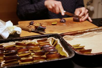 Man preparing food on cutting board