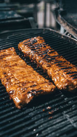 High angle view of meat on barbecue grill