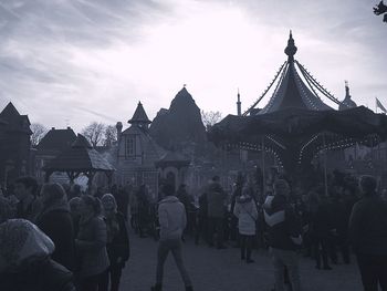 People walking in front of building
