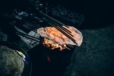 High angle view of fire on barbecue grill