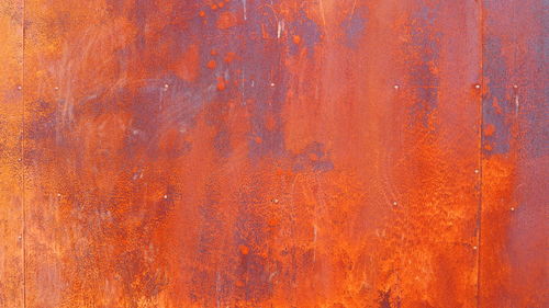 Zinc oxidation metal background , abstract orange amber scratch wall