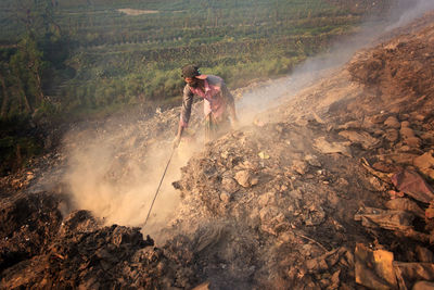 Man working at shore