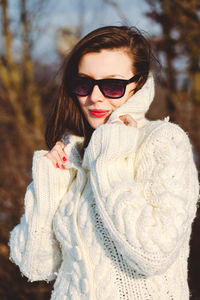 Portrait of smiling woman in snow