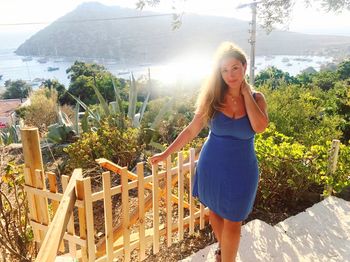 Portrait of smiling young woman standing outdoors