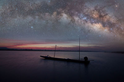 Scenic view of sea against sky at night