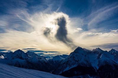 Scenic view of snowcapped mountains against sky