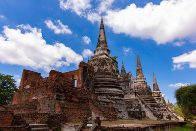 Low angle view of old temple building against sky