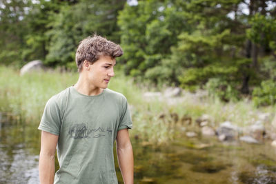 Teenage boy looking away