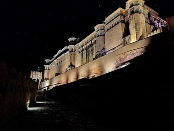 Low angle view of building against sky at night