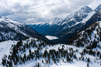 Scenic view of snowcapped mountains against sky