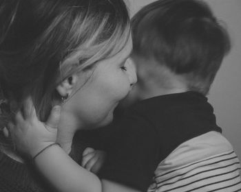 Close-up of woman with son