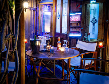 Empty chairs and tables in restaurant