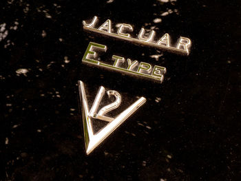 Close-up of illuminated text against black background