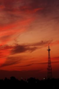 Low angle view of silhouette tower against sky during sunset