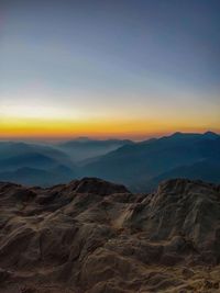 Scenic view of mountains against sky during sunset