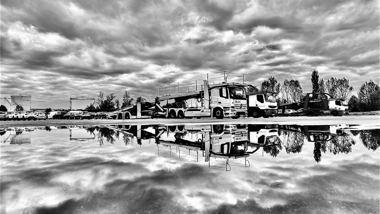 REFLECTION OF BUILDING IN LAKE