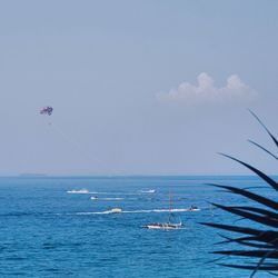 Scenic view of sea against blue sky