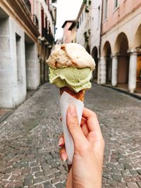 Cropped image of hand holding ice cream cone