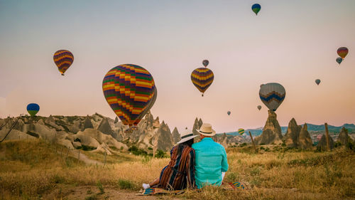 Low angle view of hot air balloons against sky