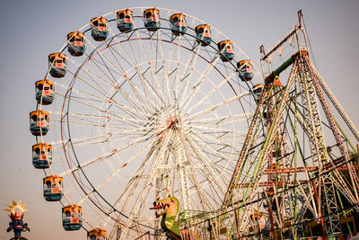 Closeup of multi-coloured giant wheel during dussehra mela in delhi, india. bottom view giant wheel