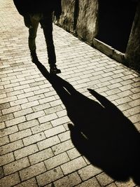 Low section of people walking on footpath