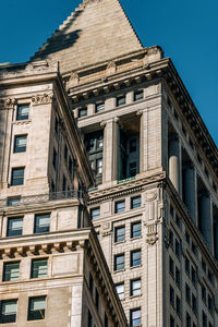 Low angle view of building against clear blue sky