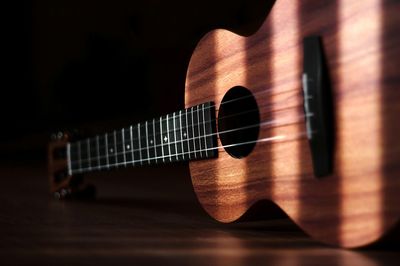 Close-up of guitar on table