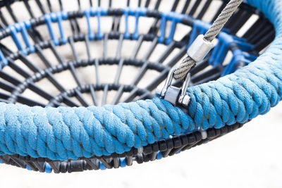 Cropped image of empty swing at playground