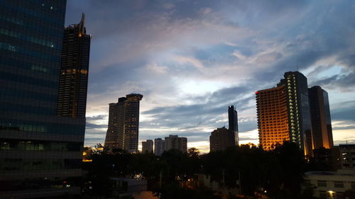 Modern buildings in city against sky