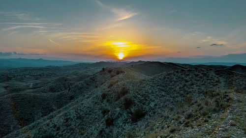 Scenic view of landscape against sky during sunset