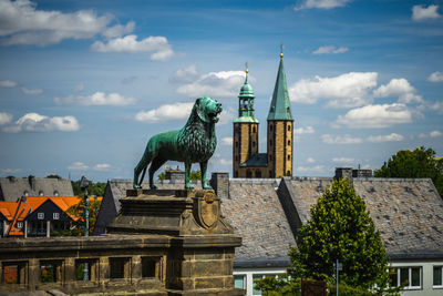 Statue of historic building against cloudy sky, blick über die dächer von goslar von der kaiserpfalz